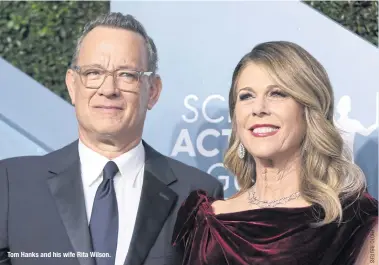  ??  ?? Tom Hanks and his wife Rita Wilson.