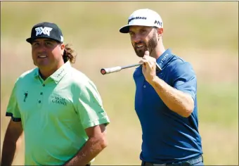  ?? PETER MORRISON/AP PHOTO ?? Pat Perez, left, and Dustin Johnson walk along the 5th hole during the second practice day at the British Open on July 17 at Royal Birkdale in Southport, England. Perez made it to the Tour Championsh­ip for the first time in his 16-year career on the...