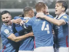  ?? Picture: Daniel Chesterton/phcimages.com ?? WINNING FEELING Pompey celebrate their third goal, scored by Jack Whatmough, at the Pirelli Stadium.