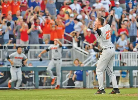  ?? THE ASSOCIATED PRESS ?? Oregon State’s Kevin Abel (23) celebrates the Beavers’ win over Arkansas in Game 3 of the College World Series in Omaha, Neb. on Thursday. Oregon State won 5-0.