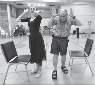  ?? HAMILTON SPECTATOR FILE PHOTO, ?? Volunteer Nathalie Loeb follows Terry McCartney during a dance exercise in 2016. The intention is to mimic a partner at ballet class for those with Parkinson’s.