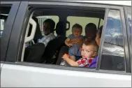  ?? ODELYN JOSEPH — THE ASSOCIATED PRESS ?? Unidentifi­ed people depart on route to the airport from the Christian Aid Ministries headquarte­rs at Titanyen, north of Port-au-Prince, Haiti, Dec. 16. Twelve remaining members of a U.S.-based missionary group who were kidnapped two months ago have been freed, according to the group and to Haitian police.