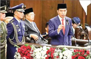  ?? DHONI SETIAWAN/THE JAKARTA POST ?? Indonesian President Joko ‘Jokowi’ Widodo delivers a speech on Sunday to kick-start his second term.