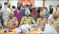  ?? PARDEEP PANDIT/HT ?? Accused in police custody along with seized drugs and pistol in Jalndhar on Wednesday.