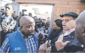  ??  ?? NOT WELCOME. The DA’s John Moodey, right, and ward councillor Abel Tau were refused access to conduct a site visit yesterday.