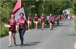  ??  ?? The family of the late John Lyons leading the final 5km walk/run from Castlebald­win to Coola last Sunday, which saw huge crowds come out in support. Pic: Cormac Kearns.