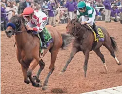  ?? GREGORY BULL/AP ?? Mike Smith, left, rides Corniche to win the Breeders’ Cup Juvenile race Friday at the Del Mar racetrack in Del Mar, Calif.