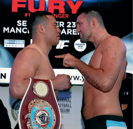  ?? REUTERS ?? Joseph Parker, left, and Hughie Fury exchange pleasantri­es before their fight in Manchester.