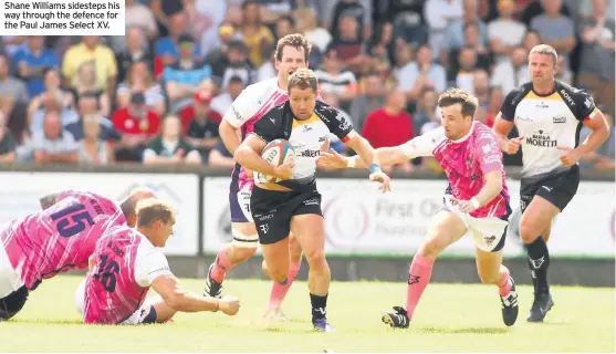  ??  ?? Shane Williams sidesteps his way through the defence for the Paul James Select XV.