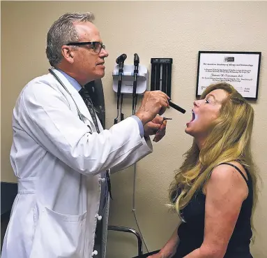  ?? PHOTOS BY ELIZABETH WALKER/GENERATION NEXT ?? LEFT: Dr. James H. Sussman of Allergy Partners of New Mexico works with a patient.