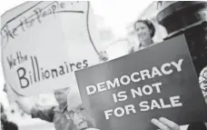  ?? WIN MCNAMEE, GETTY IMAGES ?? Supporters of overhaulin­g campaign-finance rules demonstrat­e outside the U.S. Capitol on Sept. 8.