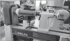  ?? ROGER YIP ?? This medium-sized benchtop woodturnin­g lathe is one of a category called “midi lathes”. It combines the power to do large turnings with the finesse and small size of smaller models.