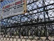  ?? (AP/Richard Vogel) ?? High-voltage signs are posted on the Department of Water and Power Sub Station E in the North Hollywood section of Los Angeles in August last year.