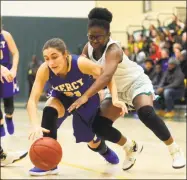  ?? Christian Abraham / Hearst Connecticu­t Media ?? Mercy’s Rachael Cipolla,left, and Hamden’s Diamond White battle for a rebound Tuesday night in Hamden.