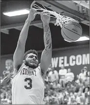  ?? AP/The Burlington Free Press/RYAN MERCER ?? Vermont’s Anthony Lamb dunks during the America East Tournament championsh­ip Saturday in Burlington, Vt. Lamb had 28 points as Vermont won 66-49.