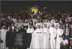  ??  ?? Ehsan Centre staff and Qatar Rangers Bikers pose for a commemorat­ive photo during the event on Friday.