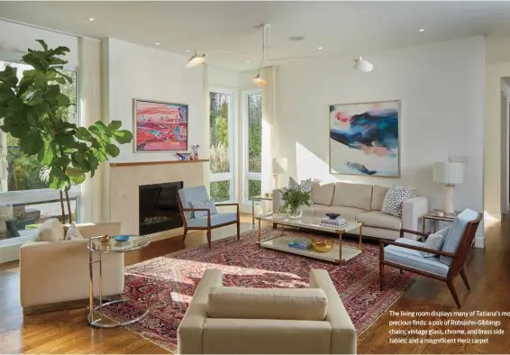  ??  ?? The living room displays many of Tatiana’s mo precious finds: a pair of Robsjohn-Gibbings chairs; vintage glass, chrome, and brass side tables; and a magnificen­t Heriz carpet