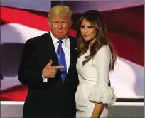  ??  ?? Trump with Melania: “smiling beatifical­ly”