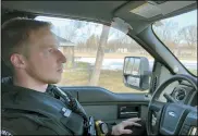  ?? TODD RICHMOND — THE ASSOCIATED PRESS ?? Wisconsin Department of Natural Resources Warden Austin Schumacher recalls March 5how he rescued a 13-year-old boy who vanished in a marsh in November, as he sits in his vehicle in the Edgerton, Wis., park where the search began.