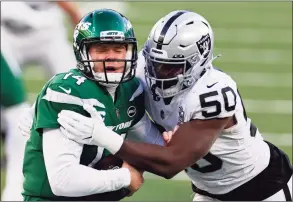  ?? Adam Hunger / Associated Press ?? Las Vegas Raiders outside linebacker Nicholas Morrow (50) sacks New York Jets quarterbac­k Sam Darnold (14) during an NFL game on Sunday in East Rutherford, N.J.