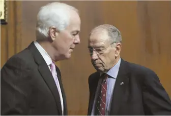  ?? AP PHOTOS ?? PROCEED WITH CARE: Senate Judiciary Committee Chairman Chuck Grassley, right, of Ohio confers with U.S. Sen. John Cornyn (R-Texas) before yesterday’s meeting.