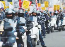  ?? Kena Betancur, Getty Images ?? New York police officers patrol Sunday during an anti-war protest after President Donald Trump launched airstrikes in Syria.