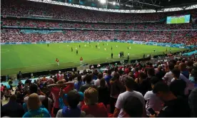  ?? Photograph: Kieran McManus/BPI/ShutSteve ?? Fans watch on nervously during the last-16 tie against Germany. Playing at the national stadium has not always been a joy for England.