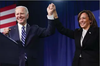  ?? PATRICK SEMANSKY — THE ASSOCIATED PRESS ?? President Joe Biden and Vice President Kamala Harris stand on stage at the Democratic National Committee winter meeting last month in Philadelph­ia.