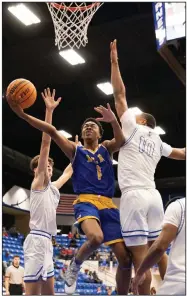  ?? (Arkansas Democrat-Gazette/Justin Cunningham) ?? North Little Rock guard Tracy Steele attempts a shot as Bryant guard Camren Hunter defends during Tuesday’s 6A-Central Conference game at Hornet Arena in Bryant.