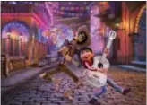  ?? DISNEY-PIXAR VIA AP ?? In this image released by Disney-Pixar, character Hector, voiced by Gael Garcia Bernal, left, and Miguel, voiced by Anthony Gonzalez, appear in a scene from the animated film, “Coco.”