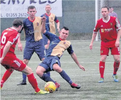  ??  ?? Digging in Kilby defender Bernard Coll tackles Rovers midfielder Graeme Holmes during Saturday’s heavy defeat