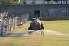  ??  ?? A tanker waters the county GAA grounds in Aughrim on Monday evening.