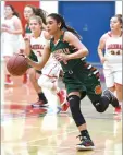  ??  ?? Portervill­e High School's Mariyah Avila-peterson dribbles down the court after stealing the ball Thursday.