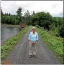  ?? TANIA BARRICKLO — DAILY FREEMAN FILE ?? Kingston Water Superinten­dent Judith Hansen stands on the dam at the city’s Cooper Lake reservoir in the town of Woodstock in June 2015.