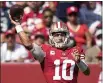  ?? TONY AVELAR — THE ASSOCIATED PRESS ?? San Francisco 49ers quarterbac­k Jimmy Garoppolo passes against the Seattle Seahawks on Sunday.