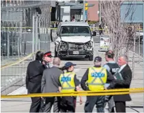  ?? THE CANADIAN PRESS FILE PHOTO ?? Police are seen near a damaged van in Toronto after it mounted a sidewalk and crashed into pedestrian­s in 2018. Alek Minassian has pleaded not guilty.