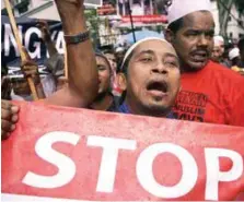  ??  ?? Rohingyas demonstrat­ing outside the Myanmar Embassy in Kuala Lumpur on Nov 25.