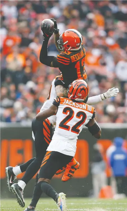  ??  ?? Browns receiver Odell Beckham Jr. is unable to complete the catch while being hit by the Bengals’ Jessie Bates on Sunday. — Getty Images