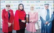  ??  ?? Salma Al-Hajjaj receiving Gulf Bank Excellence Award for the highest percentage of hires at MGRP Career Fair in 2018 fromMinist­er of State for Economic Affairs Mariam Al-Aqeel.