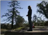  ?? ERIC RISBERG — THE ASSOCIATED PRESS ?? Jason Meek, whose northern California wine country home was destroyed in 2017, stands in the driveway and looks out at the remains of his home in Santa Rosa on Tuesday.