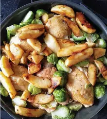  ?? TNS ?? EASY DOES IT: Chicken thighs braised in hard cider makes an easy one-pan fall dinner.