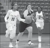  ??  ?? The Sentinel-Record/Mara Kuhn LEADING THE CHARGE: Hot Springs’ Kiah Beauford (11) drives the ball as Imani Honey (2) hustles downcourt and Pea Ridge’s Meredith Mitchell (10) defends during the Kameron Hale Invitation­al Thursday at Lake Hamilton Wolf...