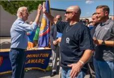  ?? Manuel Balce Ceneta/Associated Press ?? President Joe Biden greets labor union members of the Internatio­nal Brotherhoo­d of Electrical Workers Local 313 on Monday in New Castle, Del.