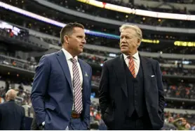  ?? Aaron Ontiveroz, The Denver Post ?? Broncos general manager George Paton, left, and president of football operations John Elway watch on the sideline at Dallas on Nov. 7.