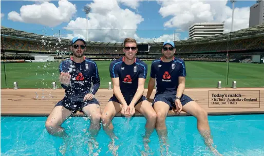  ?? Getty Images ?? England Test players James Vince (left), Jake Ball and Dawid Malan (right) visit the Pooldeck at The Gabba in Brisbane, Australia. —