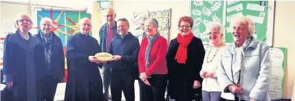  ?? Members of St Anne’s Justice and Peace and livesimply gorups. Holding the plaque are Fr Godric Timney, left, and Paul Kelly, who assessed the award for Cafod ??