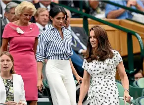  ??  ?? Meghan opted for stripes when she attended Wimbledon.