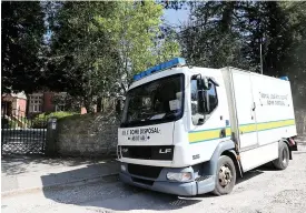  ??  ?? ●●The bomb disposal team leave the scene in Marple after the incident