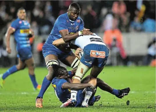  ?? IMAGES/ASHLEY VLOTMAN Picture: GALLO ?? RUGBY ROOTS: Stormers players Junior Pokomela and Seabelo Senatla (on the ground) tackle David Kriel of the Bulls during the United Rugby Championsh­ip final in June. Pokomela will return to his home town when the Stormers play the Dragons in Gqeberha on December 3.