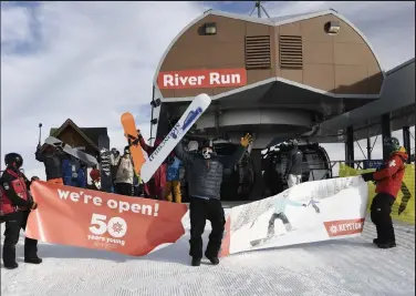  ?? Andy Cross / The Denver Post ?? Nate Dogggg bursts through the opening day banner at the River Run Gondola at Keystone Resort on Nov. 6, 2020. Dogggg was celebratin­g his 25th year of arriving at Colorado ski areas on opening day. Keystone opened for the 2021-22 season on Friday.